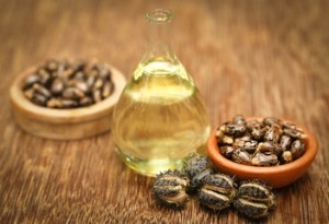 An image showing castor seeds from which castor oil is made from. The image also shows castor oil.